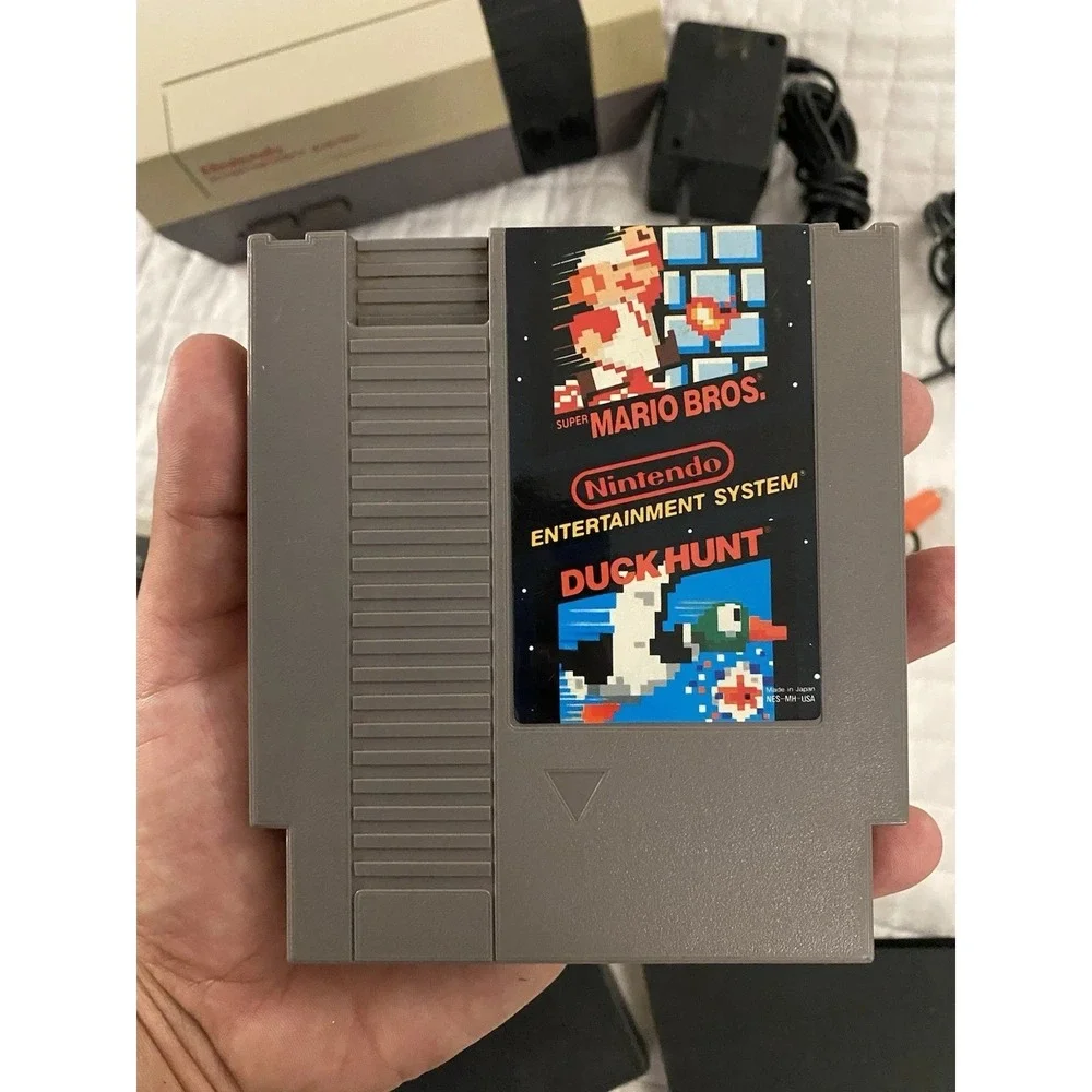 authentic NES Console Bundle with Super Mario Bros. 1,2,3 and 2 Controllers gun